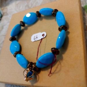 Artemis's Gems custom-made beaded bracelet with gold orb charm, blue